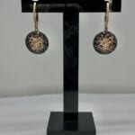 Round black, white, and gold diamond earrings