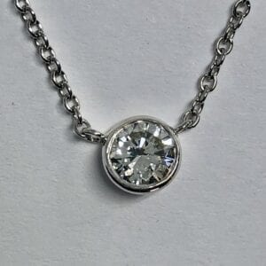 Diamond pendant on silver chain