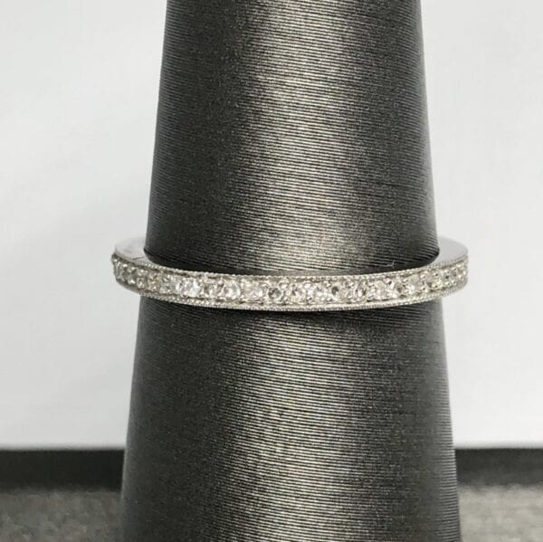 White gold ring with many smaller diamonds