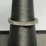 ring with small diamonds on ring stand