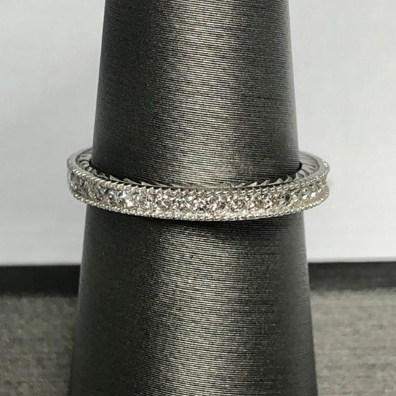 ring with small diamonds on ring stand