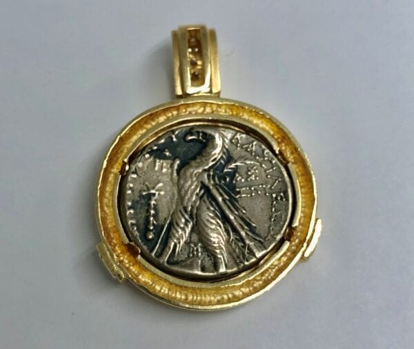 Gold ancient roman coin with diamonds