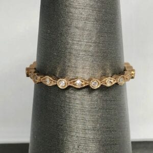 Circular and diamond-shaped band with gemstones
