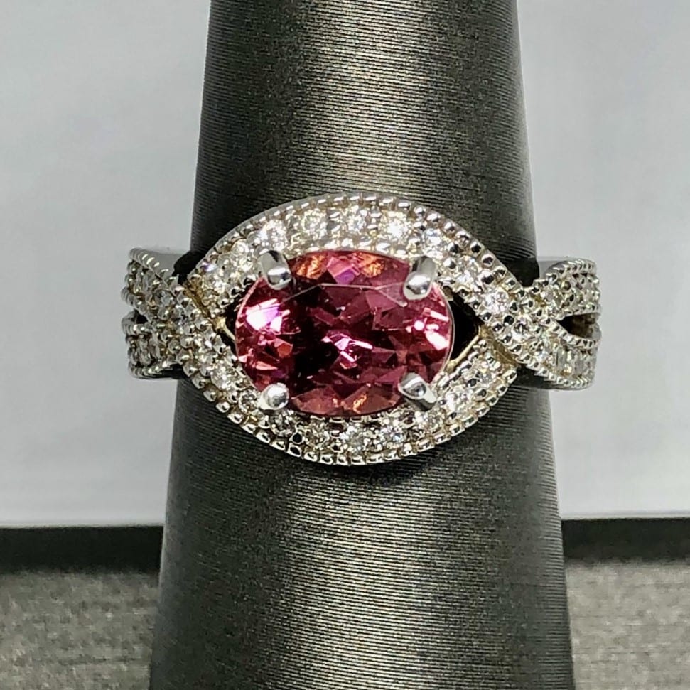 pink tourmaline gem around diamond ring