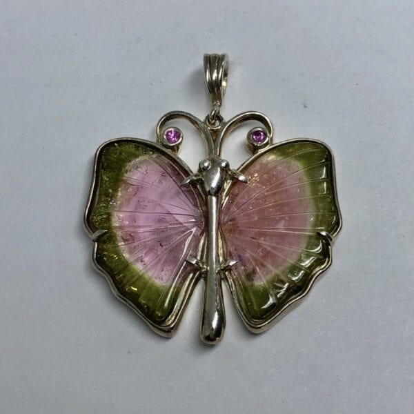 A watermelon tourmaline and pink sapphire butterfly pendant 